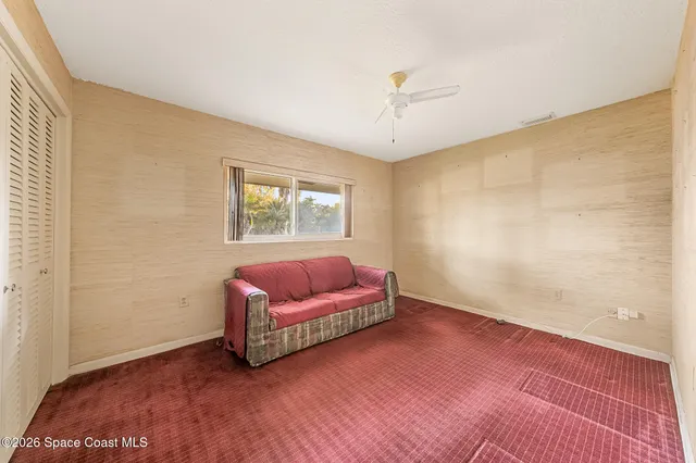 a view of a kitchen with a sink and cabinets