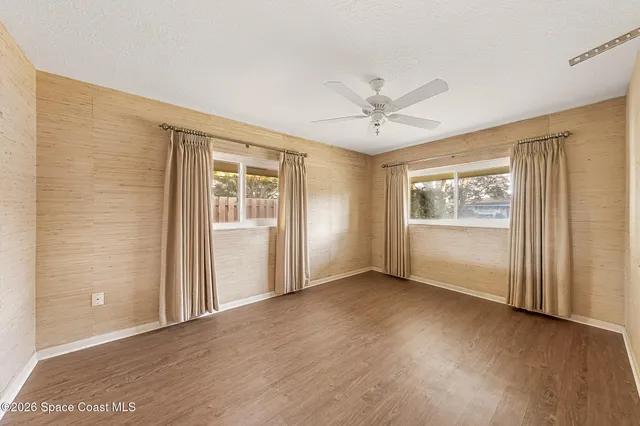 a view of a kitchen with a sink and a window