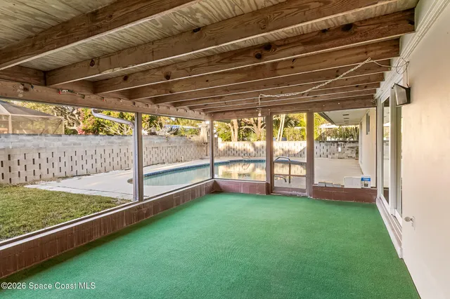 a view of a hallway with wooden floors