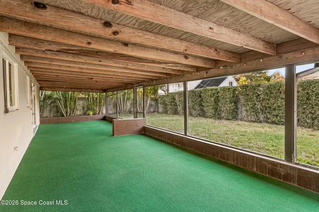 a view of a backyard with pathway