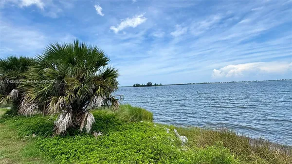 a view of a lake with a big yard