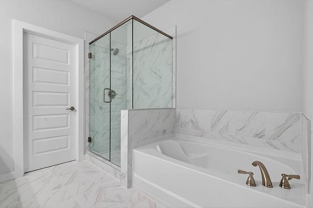 2562 Harbor Ridge Pass Gainesville, GA 30507 - Photo 25 of 27 a bathroom with a tub and shower