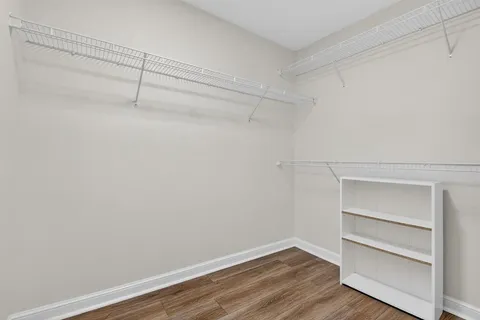a view of an entryway with wooden floor and windows