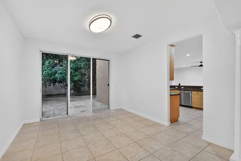a kitchen with lots of counter space and windows