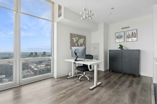 a workspace with furniture window and wooden floor
