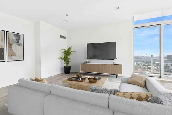 a living room with a couch and a flat screen tv