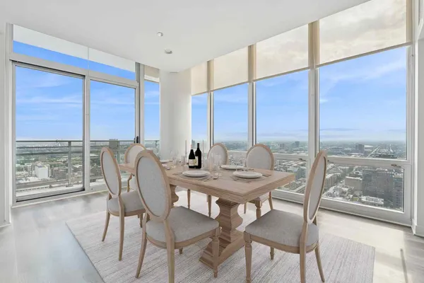 a view of a dining room with furniture window and wooden floor