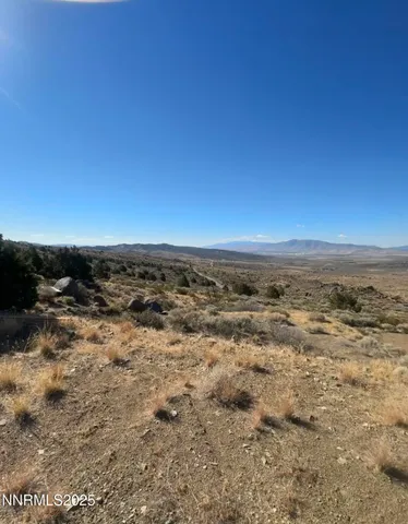 a view of a large body of water with a building in the background