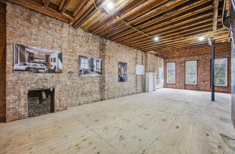 379 7th Street Brooklyn, NY 11215 - Photo 14 of 17 a view of an empty room with a fireplace