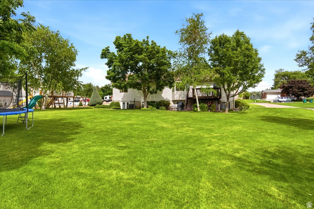 5321 South 3100th Street West Roy, UT 84067 - Photo 7 of 64 Expansive green lawn providing abundant outdoor space