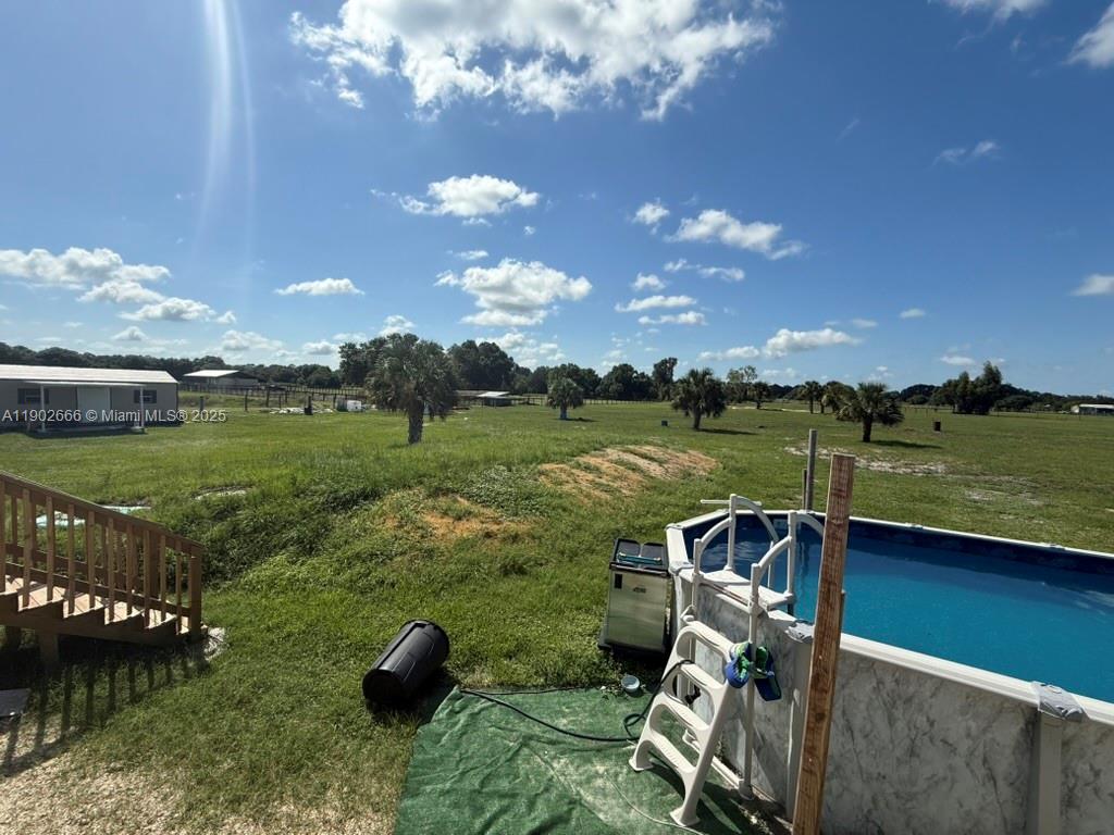 1250 Homestead Avenue Clewiston, FL 33440 - Photo 18 of 32 a view of a golf course with a lake