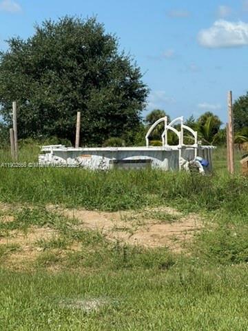 1250 Homestead Avenue Clewiston, FL 33440 - Photo 25 of 32 a backyard of a house with lots of green space