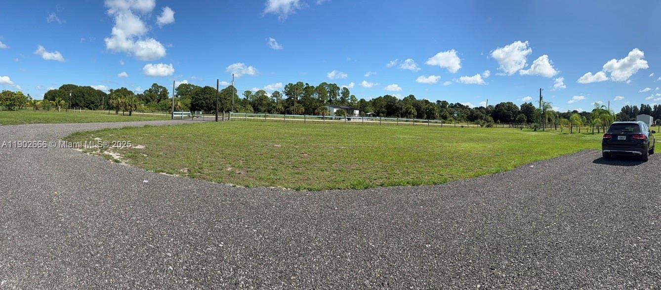 1250 Homestead Avenue Clewiston, FL 33440 - Photo 26 of 32 a view of a golf course with a lake
