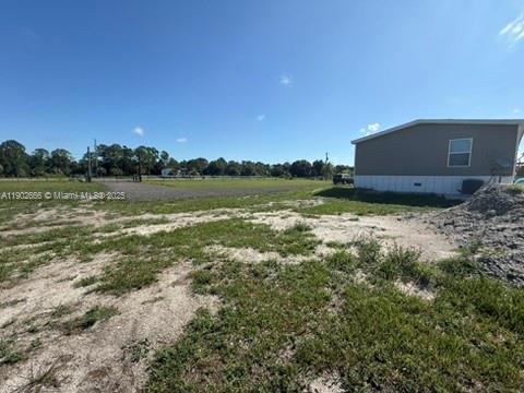 1250 Homestead Avenue Clewiston, FL 33440 - Photo 29 of 32 a view of a lake from a yard