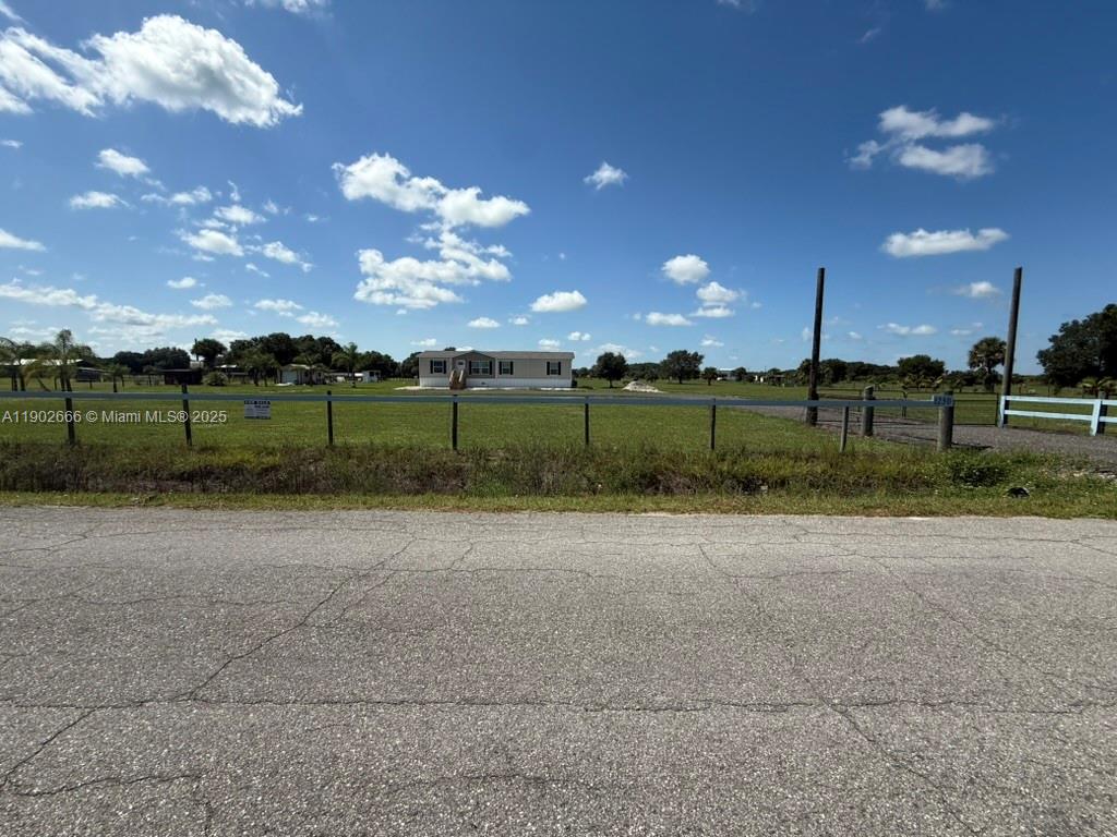 1250 Homestead Avenue Clewiston, FL 33440 - Photo 30 of 32 a view of a big yard with a tree