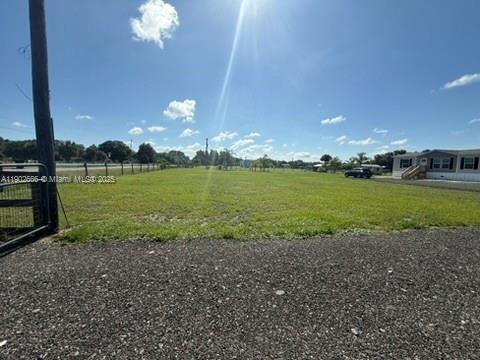 1250 Homestead Avenue Clewiston, FL 33440 - Photo 32 of 32 a view of a golf course with a lake