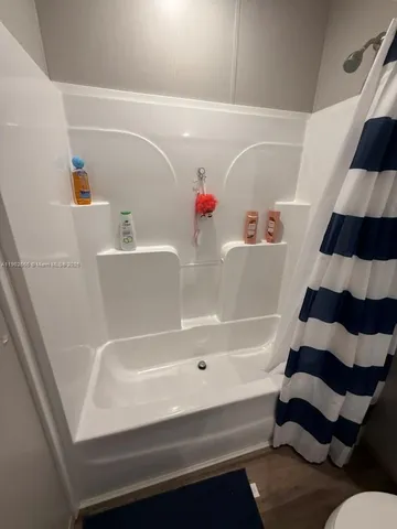 a bathroom with a bathtub and a sink