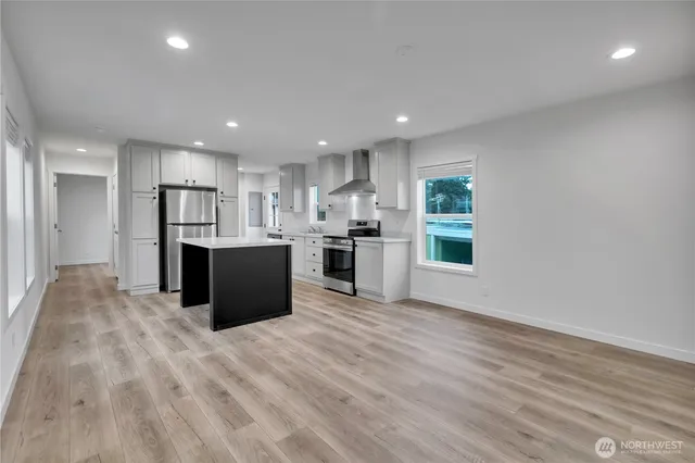 a view of kitchen with wooden floor
