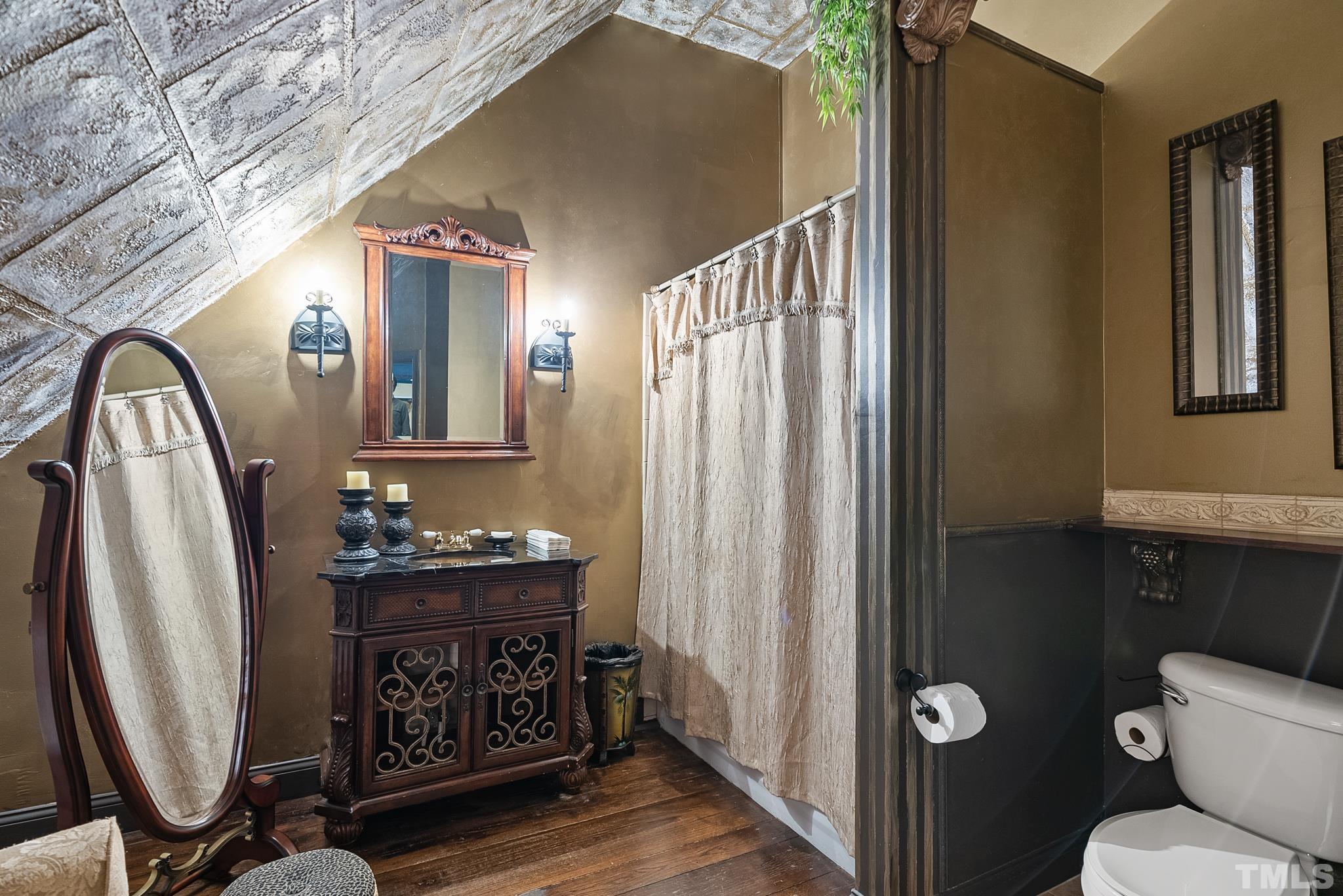 104 Pope Lake Road Angier, NC 27501 - Photo 36 of 49 a bathroom with a sink a mirror and a toilet