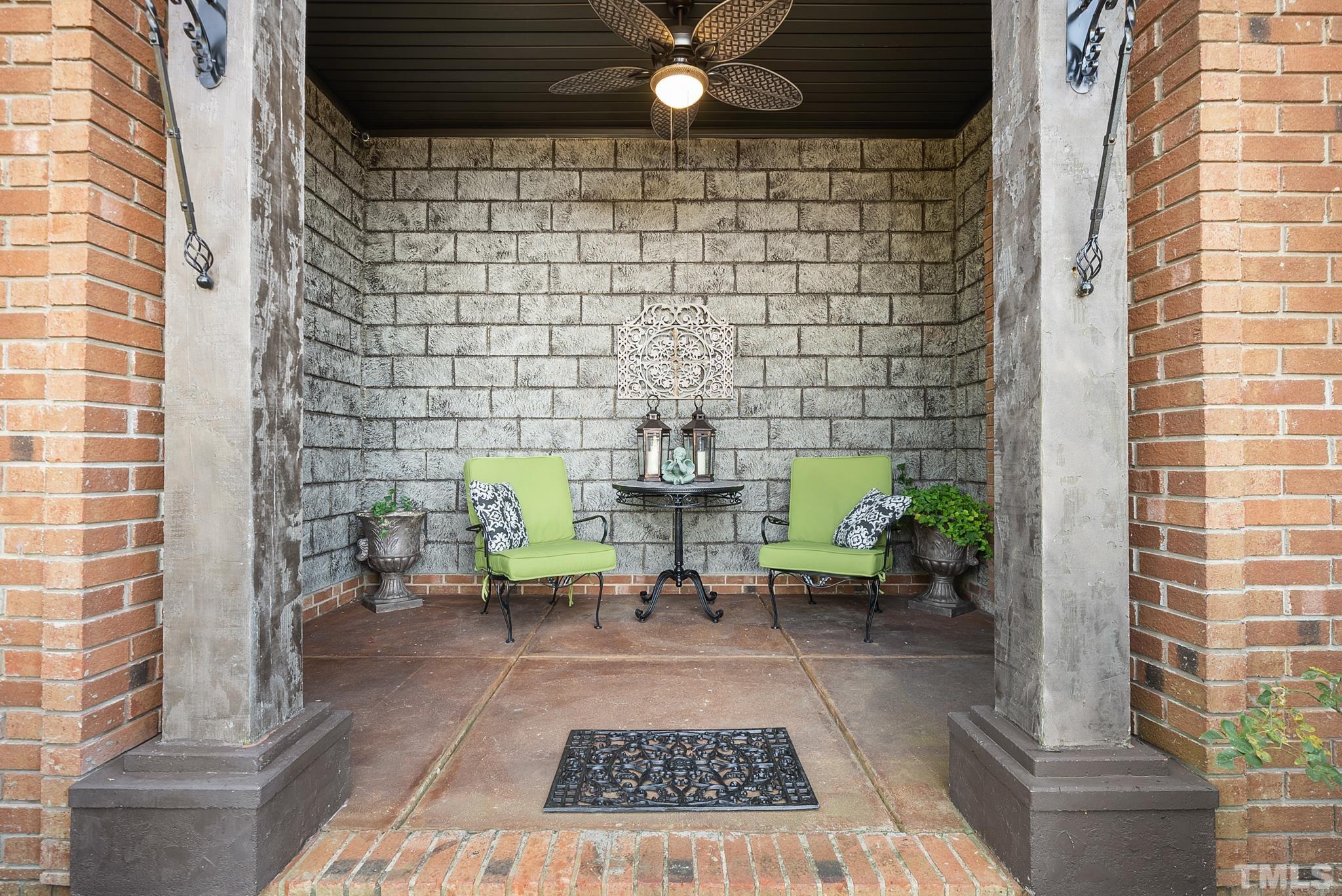 104 Pope Lake Road Angier, NC 27501 - Photo 44 of 49 a view of a patio with table and chairs potted plants