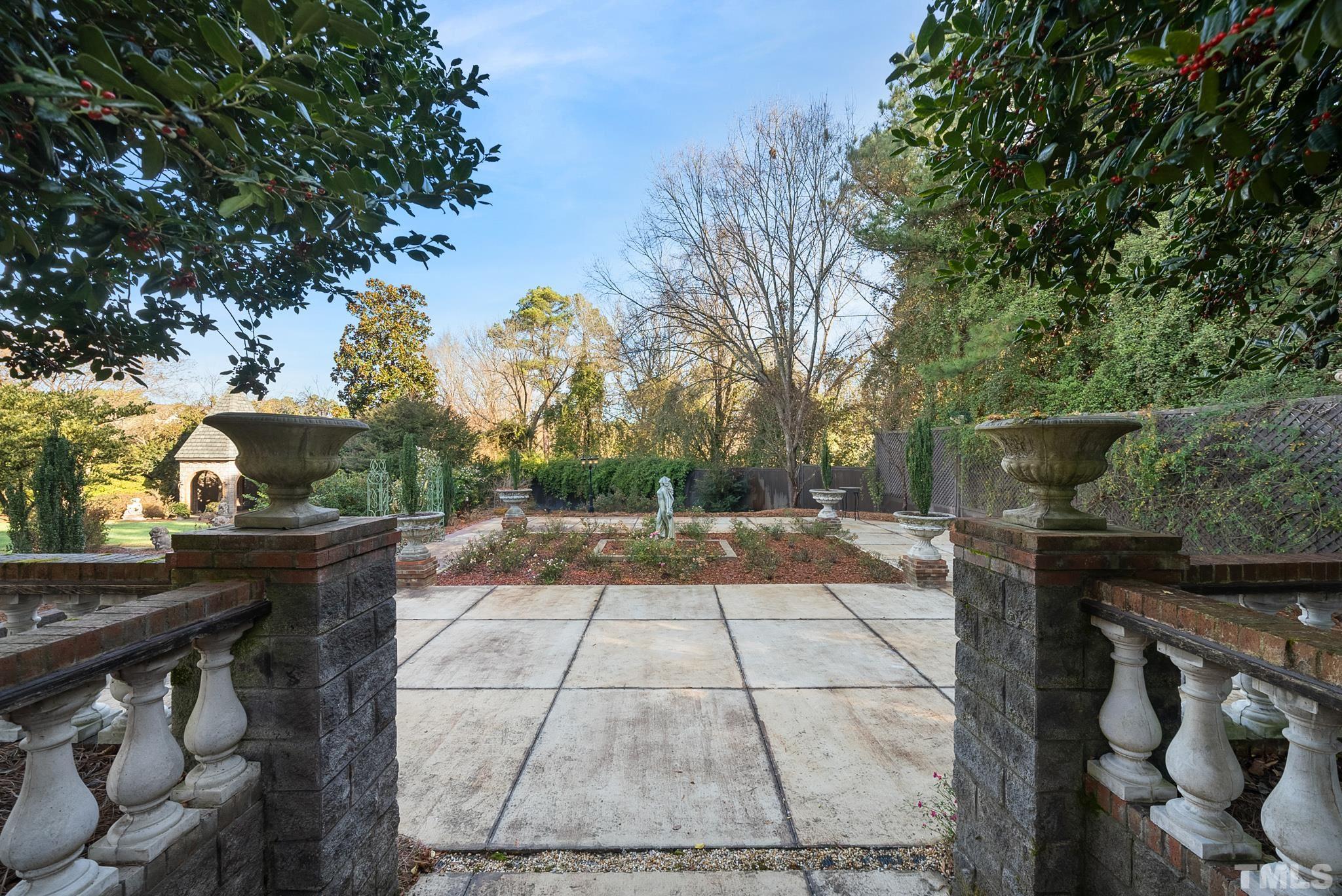 104 Pope Lake Road Angier, NC 27501 - Photo 8 of 49 a view of a patio with table and chairs and potted plants
