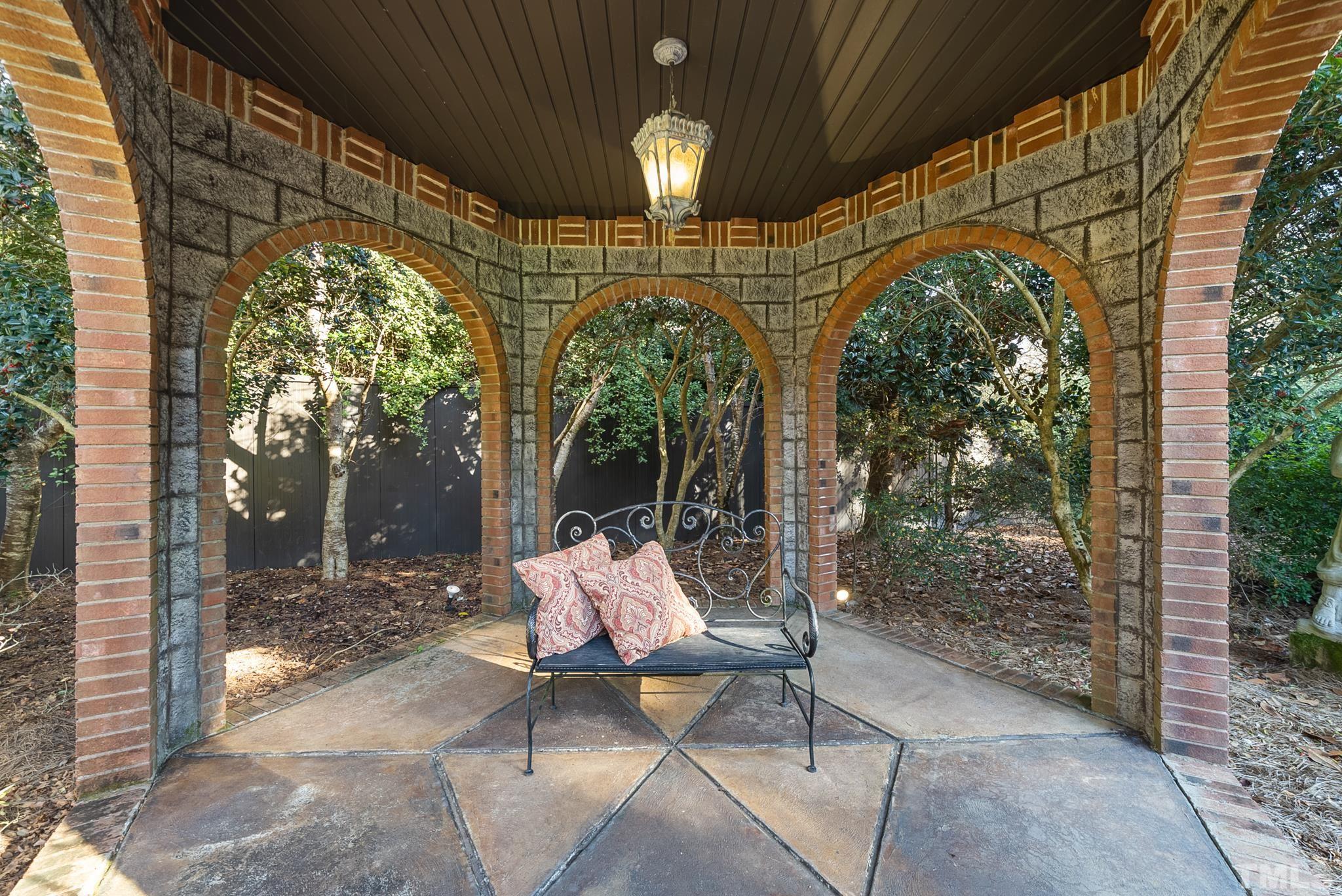 104 Pope Lake Road Angier, NC 27501 - Photo 9 of 49 a patio with table and chairs and potted plants