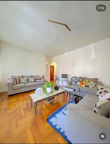 a living room with furniture and a table