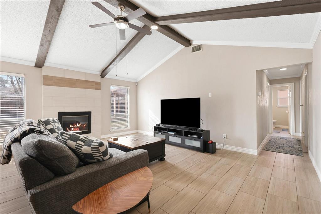 7636 Castillo Road Fort Worth, TX 76112 - Photo 1 of 28 a living room with furniture and a flat screen tv