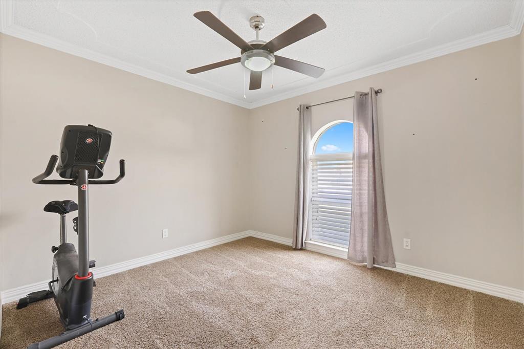 7636 Castillo Road Fort Worth, TX 76112 - Photo 19 of 28 a view of room with a ceiling fan
