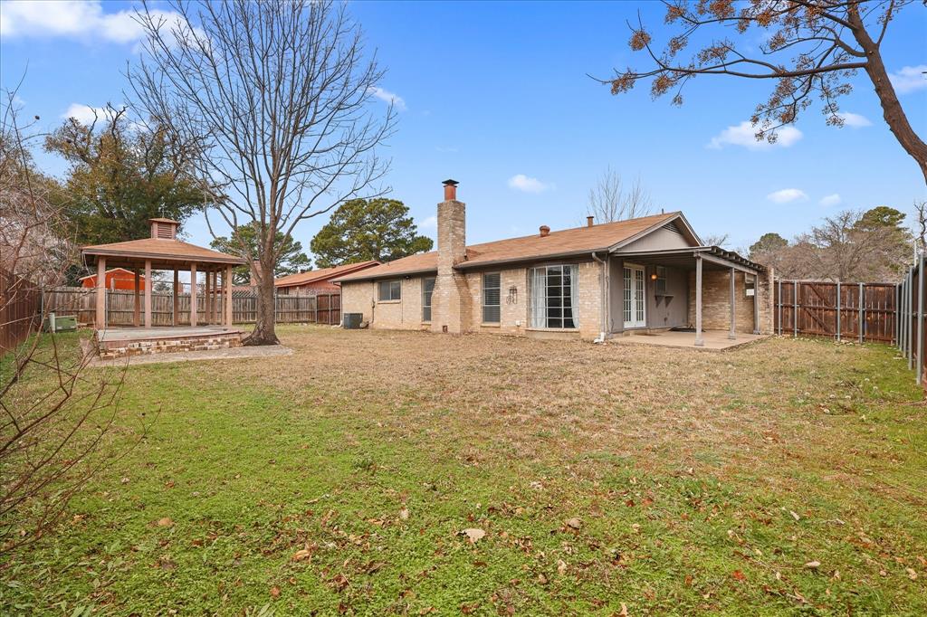 7636 Castillo Road Fort Worth, TX 76112 - Photo 21 of 28 a front view of a house with a garden