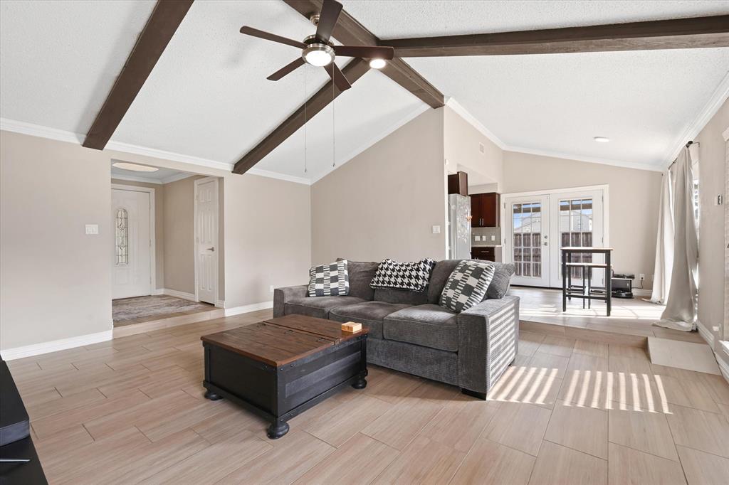 7636 Castillo Road Fort Worth, TX 76112 - Photo 6 of 28 a living room with furniture and a wooden floor