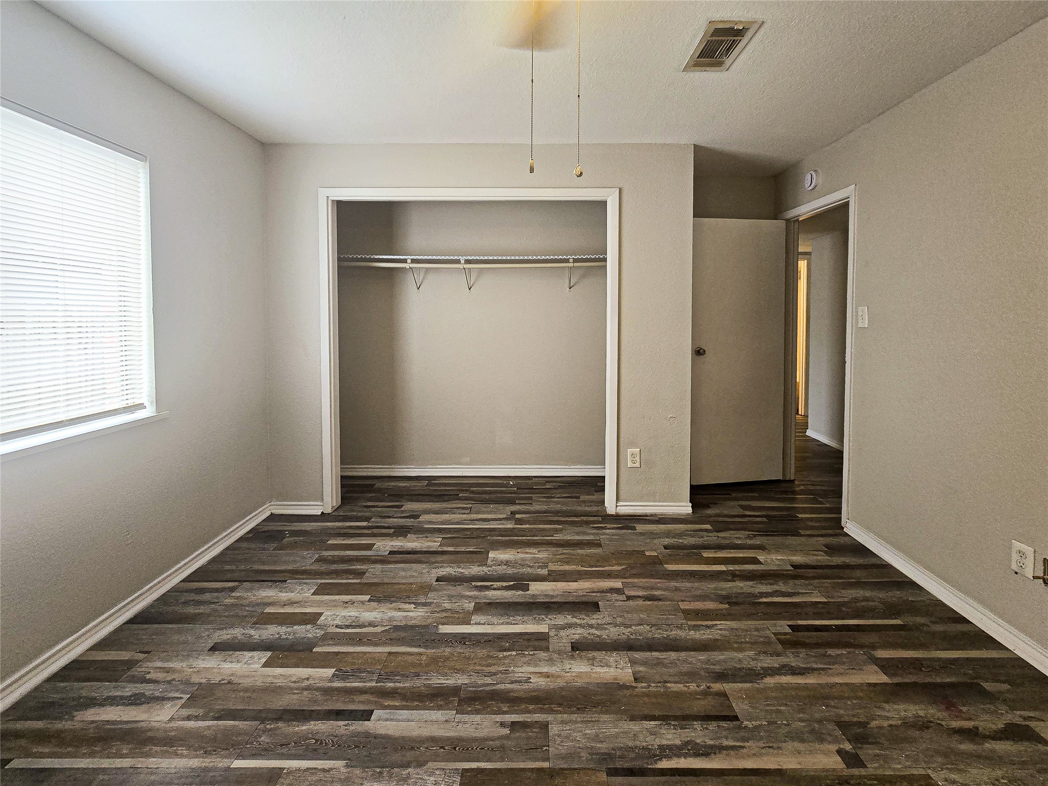 396 Duroux Road, Unit B La Marque, TX 77568 - Photo 2 of 9 a view of a livingroom with wooden floor and a window