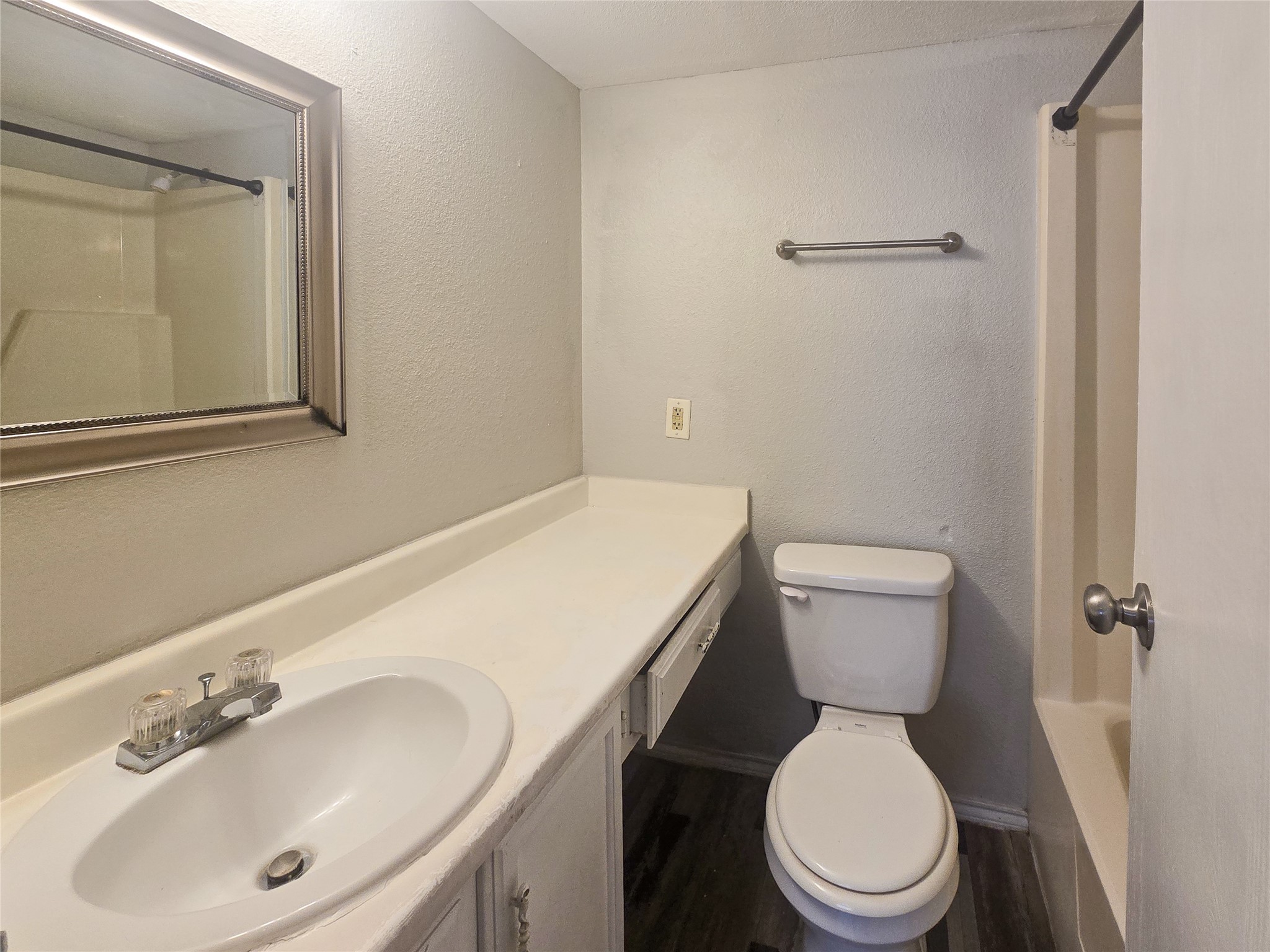 396 Duroux Road, Unit B La Marque, TX 77568 - Photo 6 of 9 a white toilet sitting next to a bathroom sink