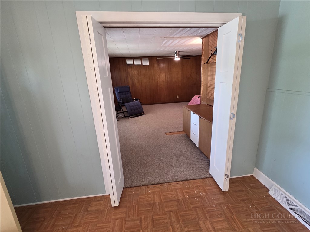 145 Black Oak Ridge Road Taylorsville, NC 28681 - Photo 15 of 39 a view of a hallway with wooden shelves and closet