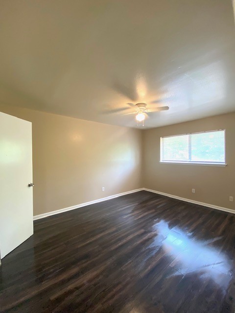 3206 Lobit Drive, Unit 14 Dickinson, TX 77539 - Photo 6 of 11 an empty room with wooden floor and windows