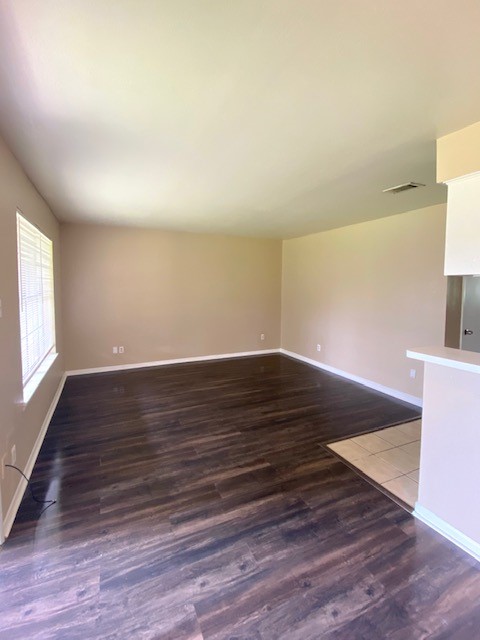 3206 Lobit Drive, Unit 14 Dickinson, TX 77539 - Photo 8 of 11 an empty room with wooden floor and windows