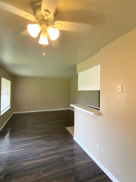 3206 Lobit Drive, Unit 14 Dickinson, TX 77539 - Photo 9 of 11 a view of a room with wooden floor and a ceiling fan