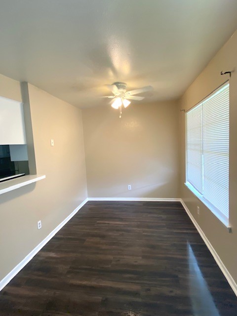 3206 Lobit Drive, Unit 14 Dickinson, TX 77539 - Photo 10 of 11 a view of an empty room with wooden floor and a window