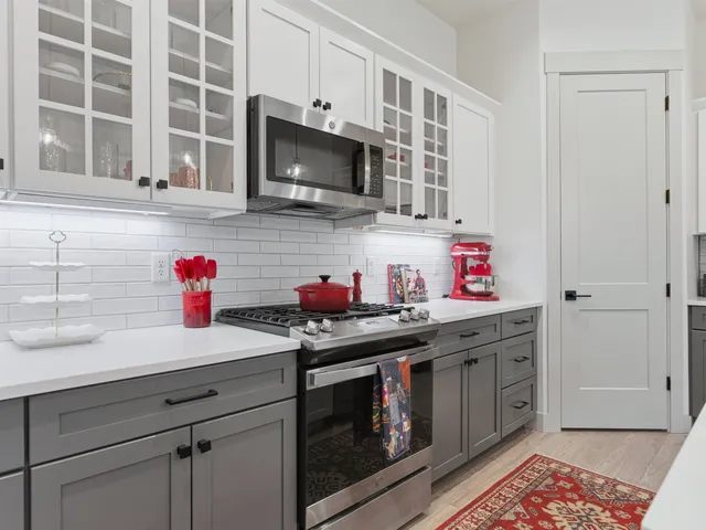 a kitchen with a sink cabinets and stainless steel appliances