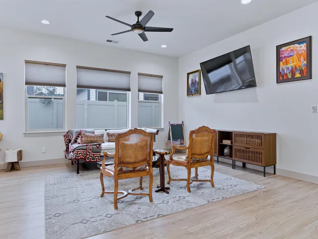 a living room with furniture and a rug