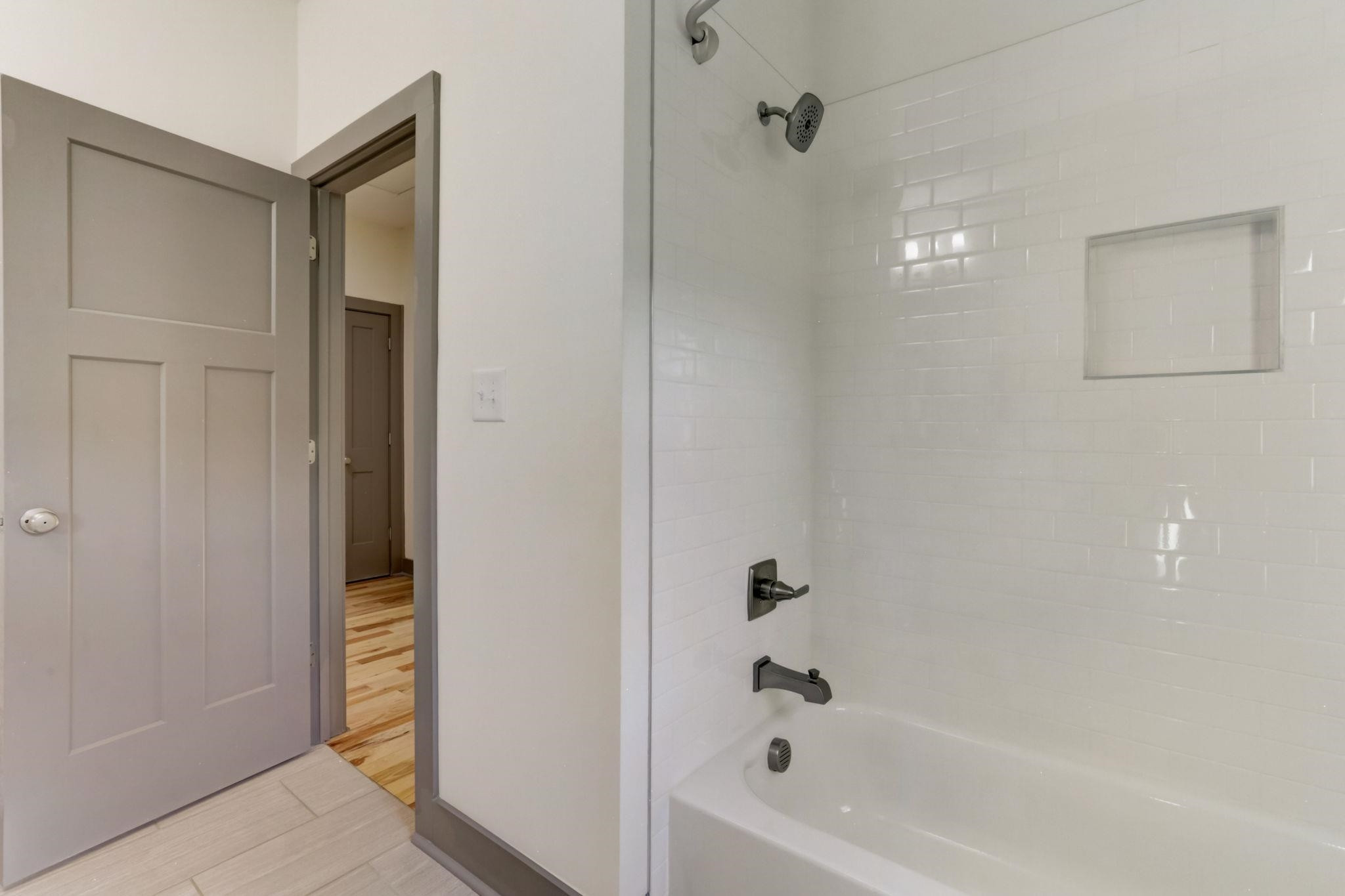 7 Hill Street Raleigh, NC 27610 - Photo 20 of 25 a bathroom with a bathtub
