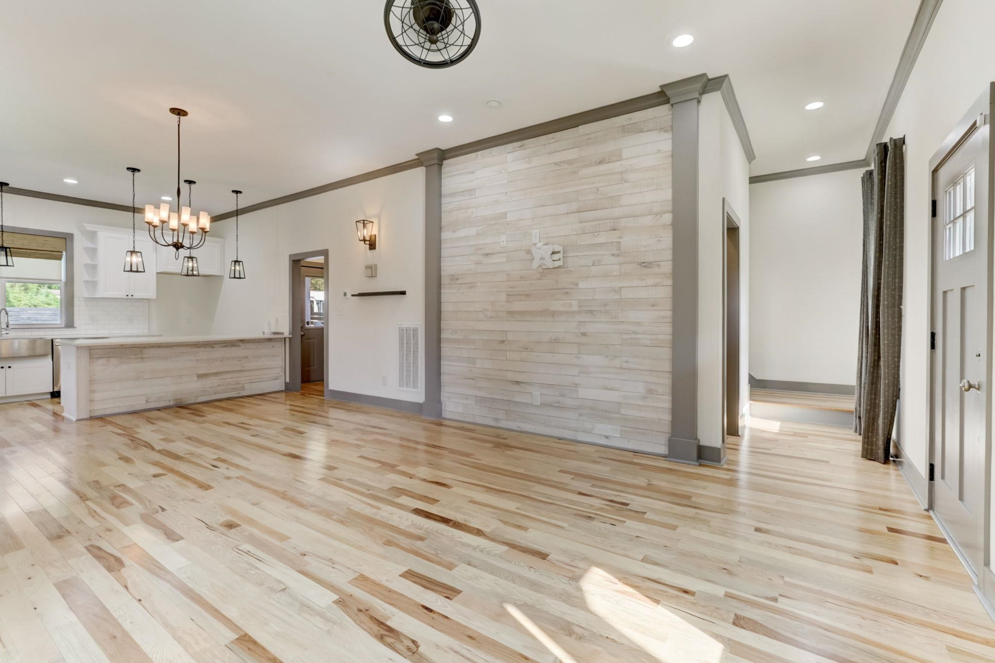 7 Hill Street Raleigh, NC 27610 - Photo 3 of 25 a view of a hallway with wooden floor