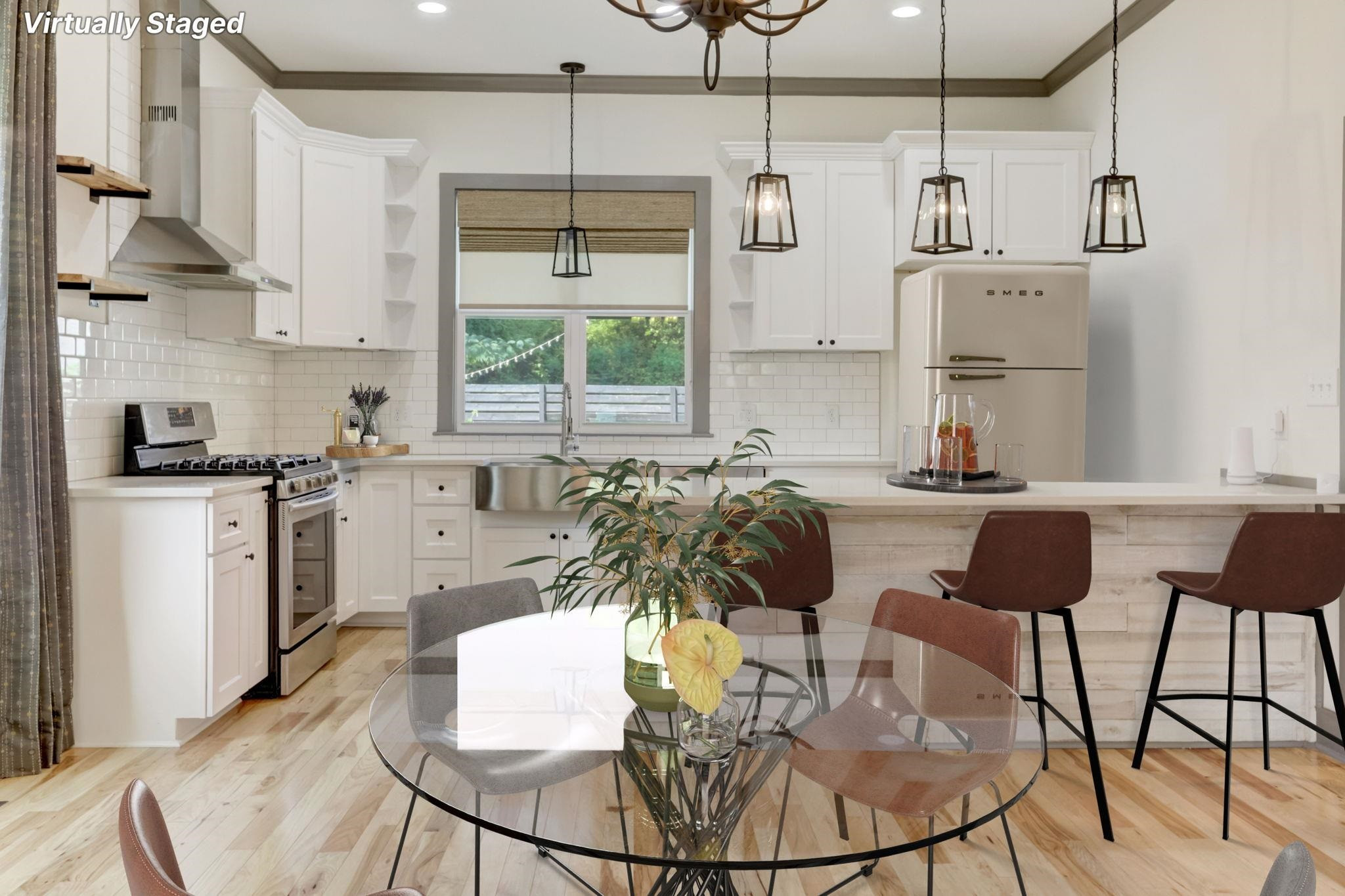 7 Hill Street Raleigh, NC 27610 - Photo 9 of 25 a kitchen with stainless steel appliances kitchen island granite countertop a table chairs and a refrigerator