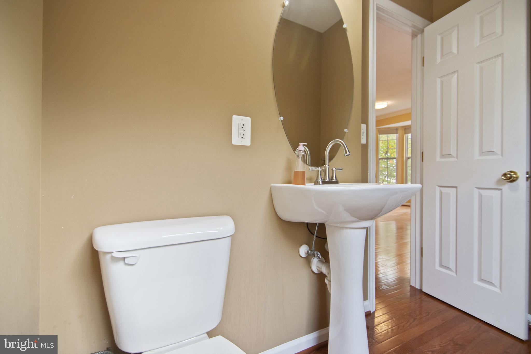 7171 Water Oak Road, Unit 175 Elkridge, MD 21075 - Photo 16 of 49 7171 WATER OAK-POWDER ROOM W/ VIEW TO LIVING ROOM