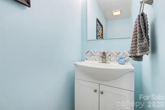 a close view of a sink a table and chair
