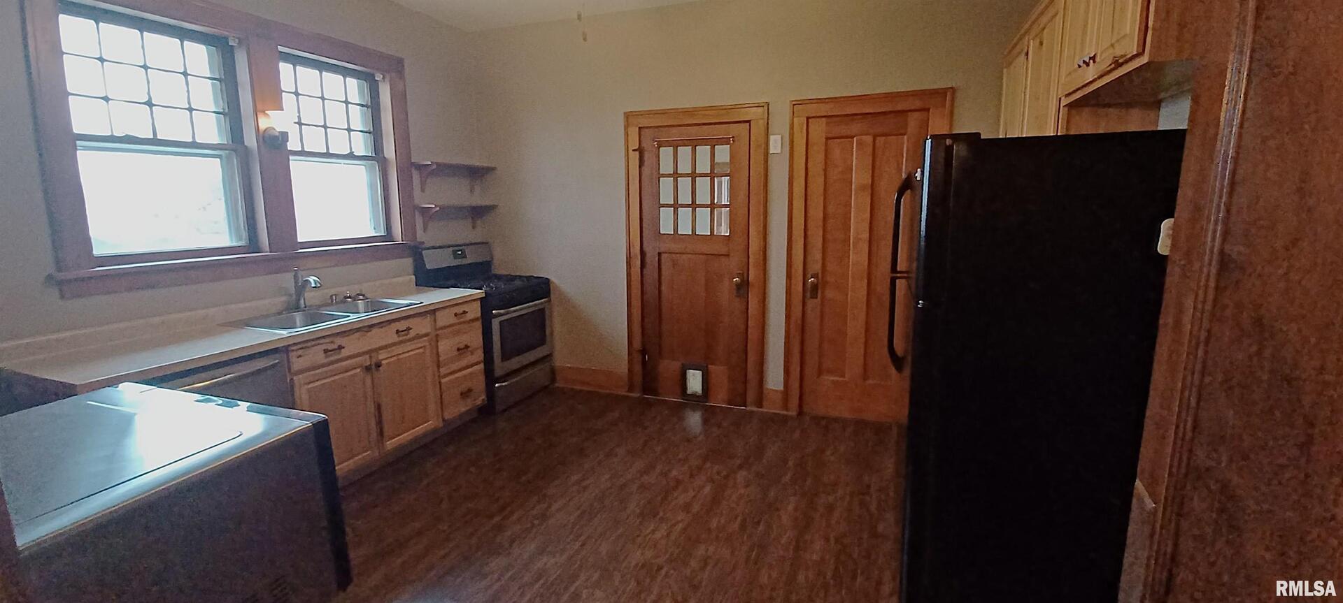 125 A Street Buda, IL 61314 - Photo 13 of 29 a kitchen with granite countertop a refrigerator and a sink