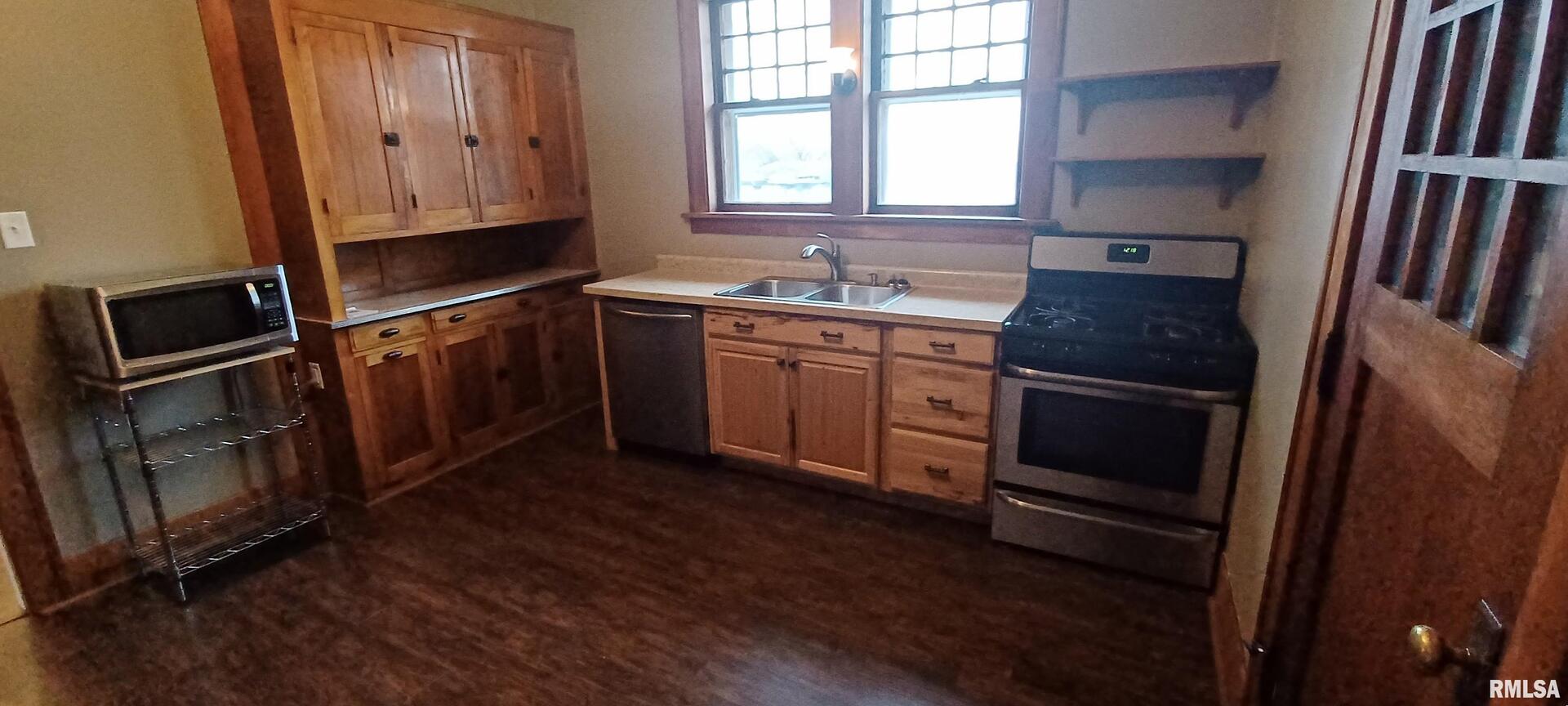 125 A Street Buda, IL 61314 - Photo 15 of 29 a kitchen with granite countertop a refrigerator stove and sink