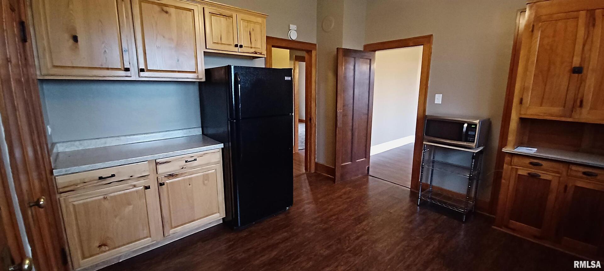 125 A Street Buda, IL 61314 - Photo 17 of 29 a kitchen with granite countertop stainless steel appliances and wooden cabinets