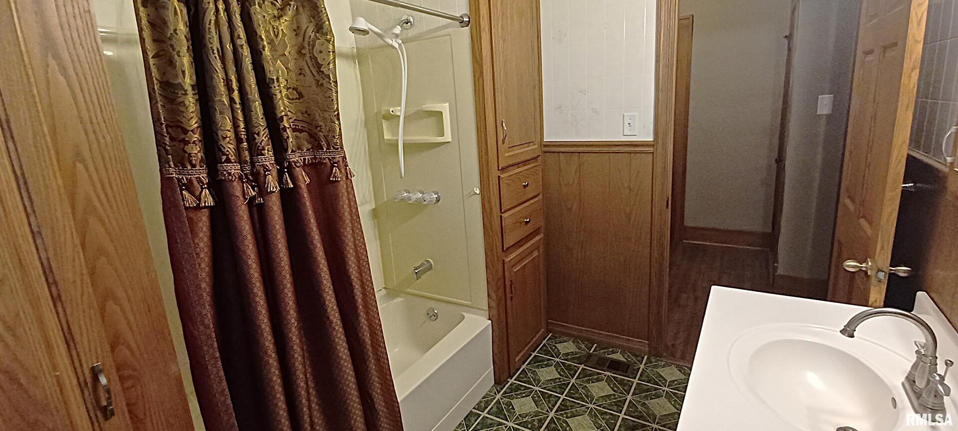 125 A Street Buda, IL 61314 - Photo 27 of 29 a bathroom with a sink a toilet and shower