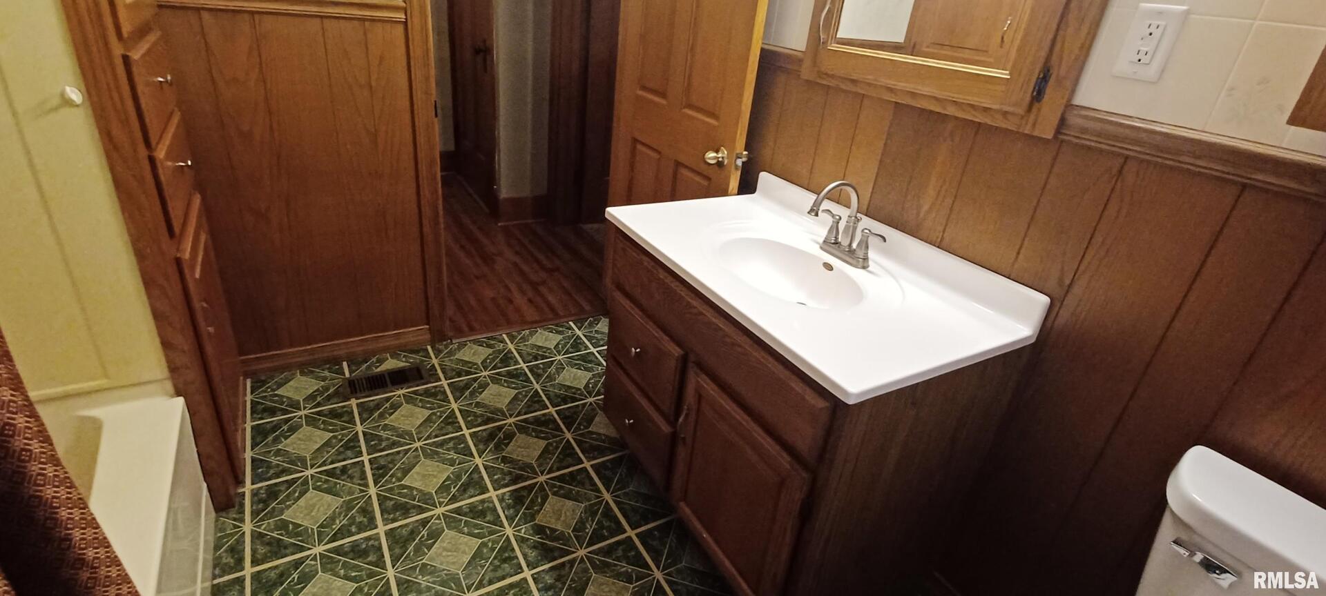 125 A Street Buda, IL 61314 - Photo 28 of 29 a bathroom with a sink and a mirror